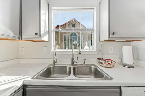 a bed room with a bed and a dresser in it