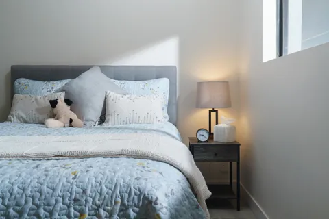 a bedroom with a bed and a television