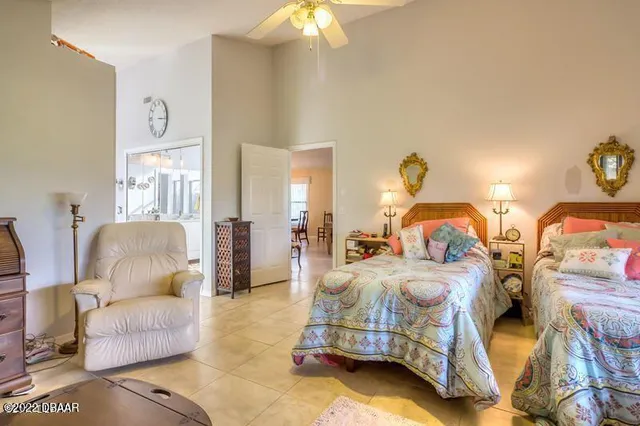 a bedroom with bed and a couch