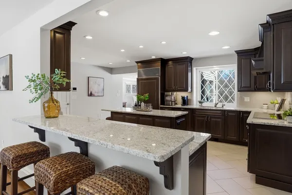 a kitchen with granite countertop lots of counter top space