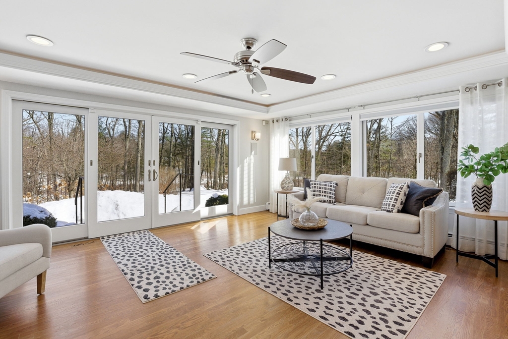 10 Bridle Path North Andover, MA 01845 - Photo 20 of 42 a living room with furniture a large window and a chandelier