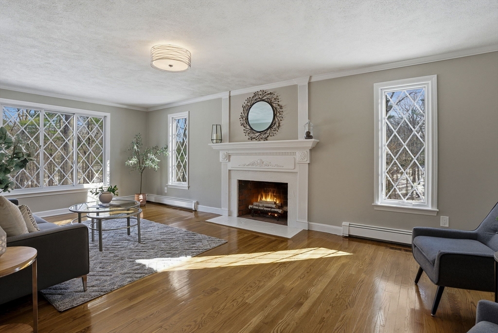 10 Bridle Path North Andover, MA 01845 - Photo 27 of 42 a living room with furniture and a fireplace