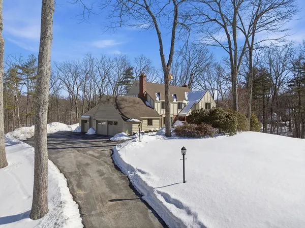 a view of a house with snow on the yard