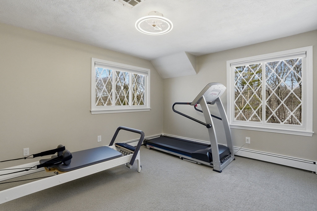 10 Bridle Path North Andover, MA 01845 - Photo 31 of 42 a view of a room with gym equipment