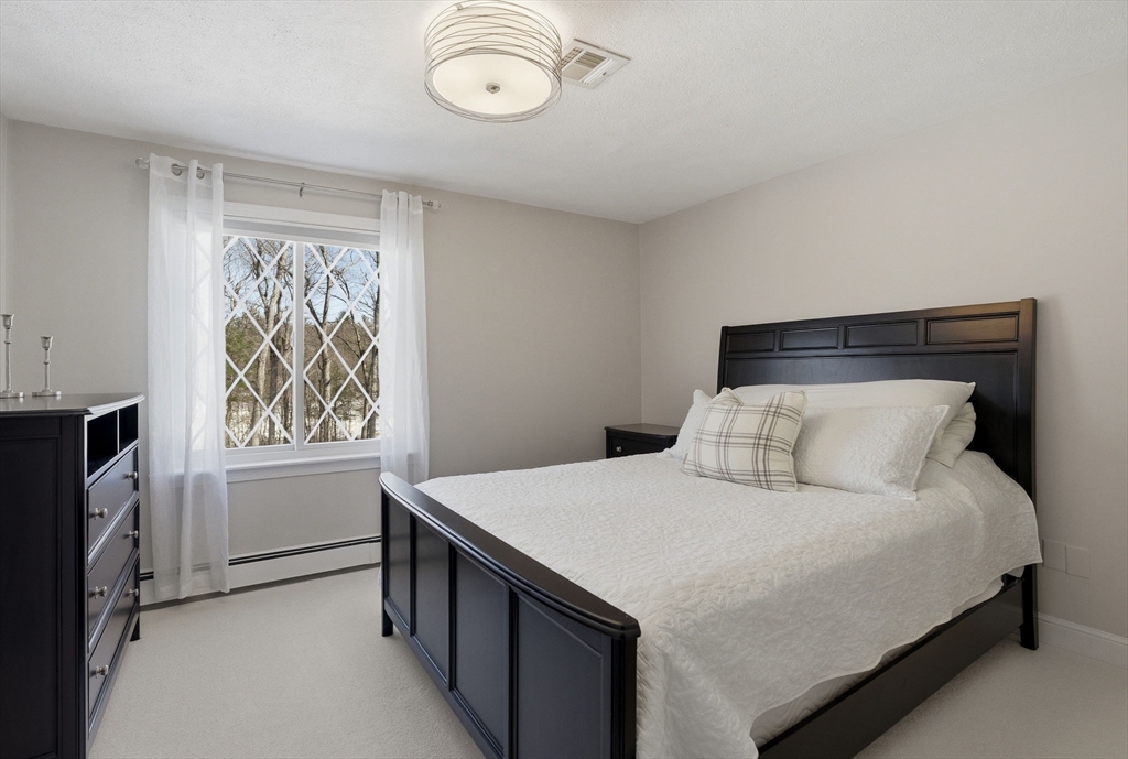 10 Bridle Path North Andover, MA 01845 - Photo 32 of 42 a bedroom with a bed and a window