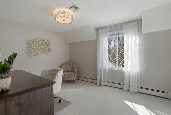 a view of room with window and wooden floor