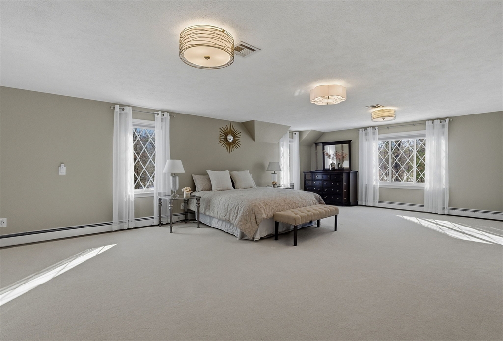 10 Bridle Path North Andover, MA 01845 - Photo 35 of 42 a spacious bedroom with a bed and window