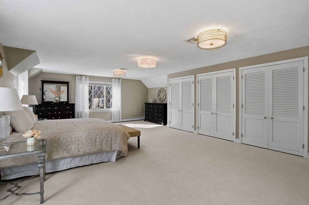 10 Bridle Path North Andover, MA 01845 - Photo 36 of 42 a spacious bedroom with a bed and window