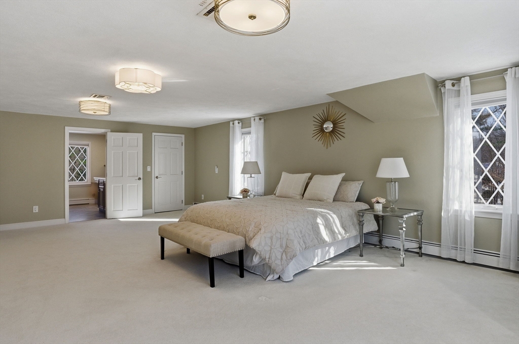 10 Bridle Path North Andover, MA 01845 - Photo 37 of 42 a spacious bedroom with a bed and closet