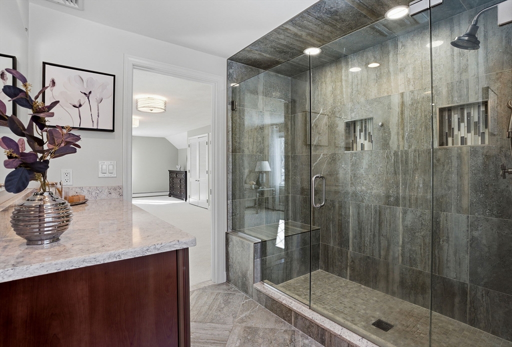 10 Bridle Path North Andover, MA 01845 - Photo 40 of 42 a bathroom with a shower sink and mirror