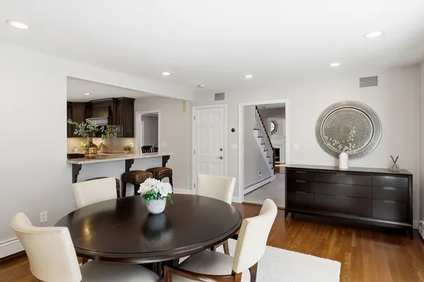 a kitchen with a table and chairs