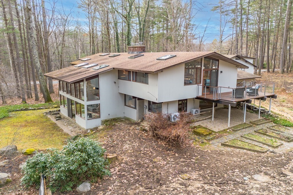 88 Heald Road Carlisle, MA 01741 - Photo 1 of 42 a view of a house with pool and chairs