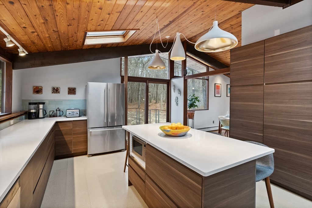 88 Heald Road Carlisle, MA 01741 - Photo 11 of 42 a kitchen with stainless steel appliances a sink and a refrigerator