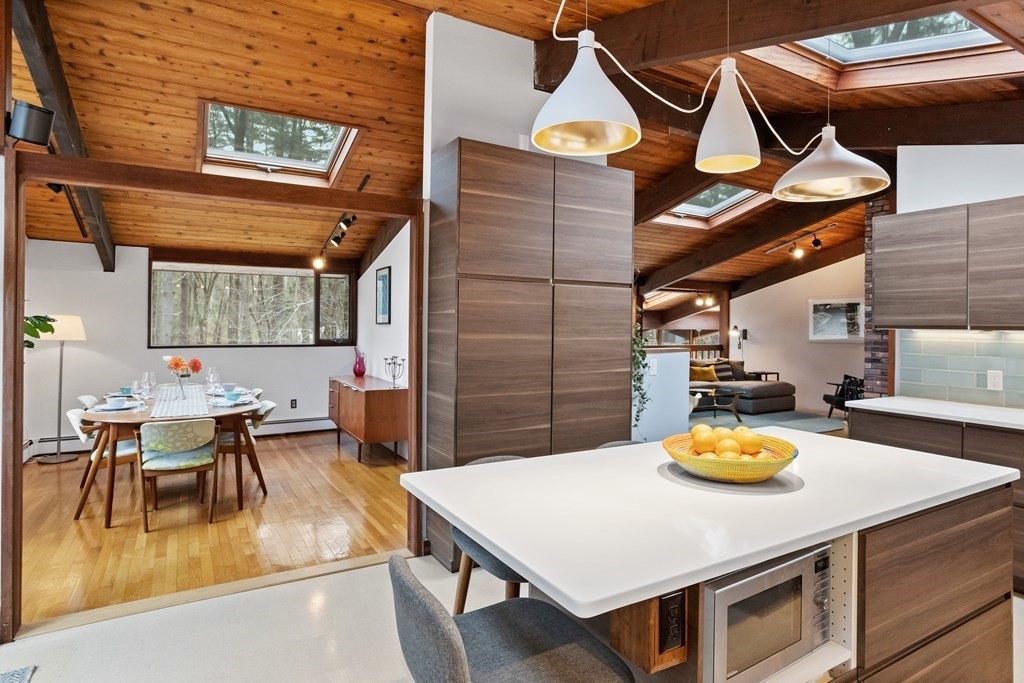 88 Heald Road Carlisle, MA 01741 - Photo 12 of 42 a view of a dining room with furniture and wooden floor