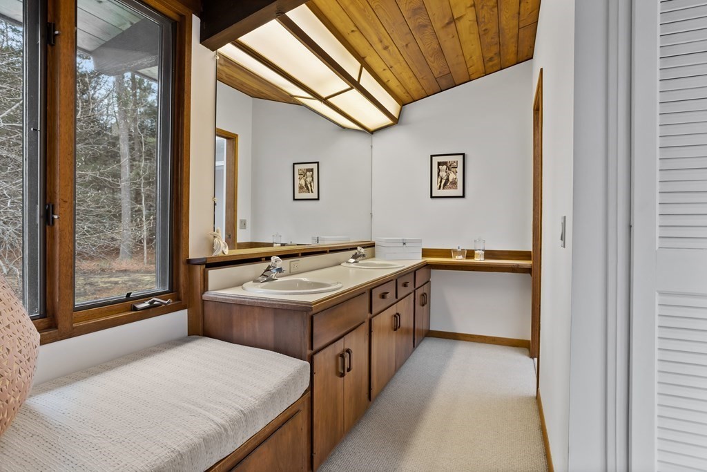 88 Heald Road Carlisle, MA 01741 - Photo 21 of 42 a bathroom with a sink and a mirror
