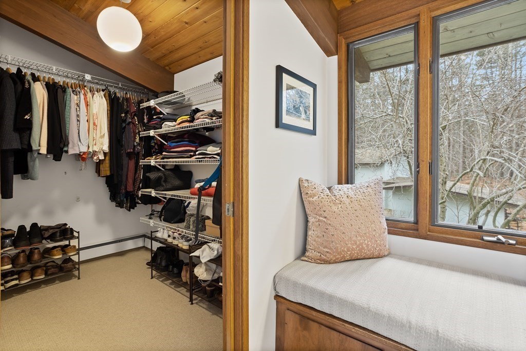 88 Heald Road Carlisle, MA 01741 - Photo 23 of 42 a bedroom with a bed and a large window
