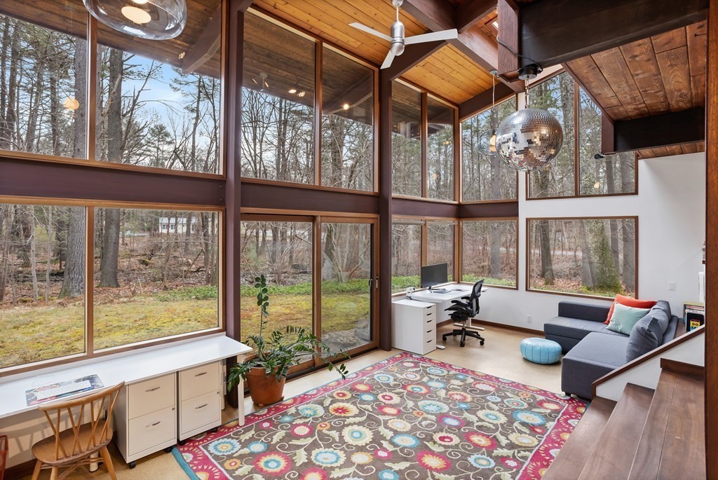 88 Heald Road Carlisle, MA 01741 - Photo 27 of 42 a living room with furniture and a large window