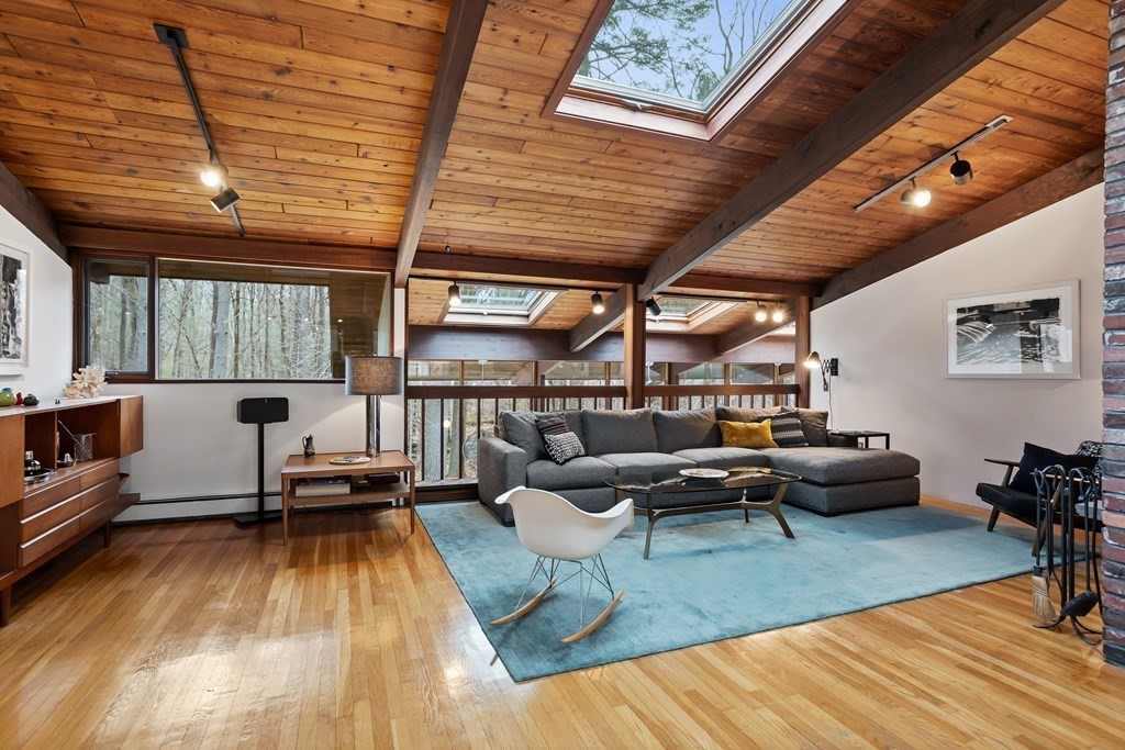 88 Heald Road Carlisle, MA 01741 - Photo 3 of 42 a living room with furniture and a wooden floor