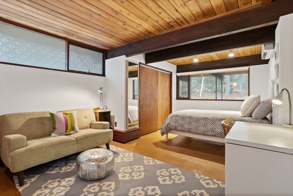 88 Heald Road Carlisle, MA 01741 - Photo 32 of 42 a living room with furniture and a rug