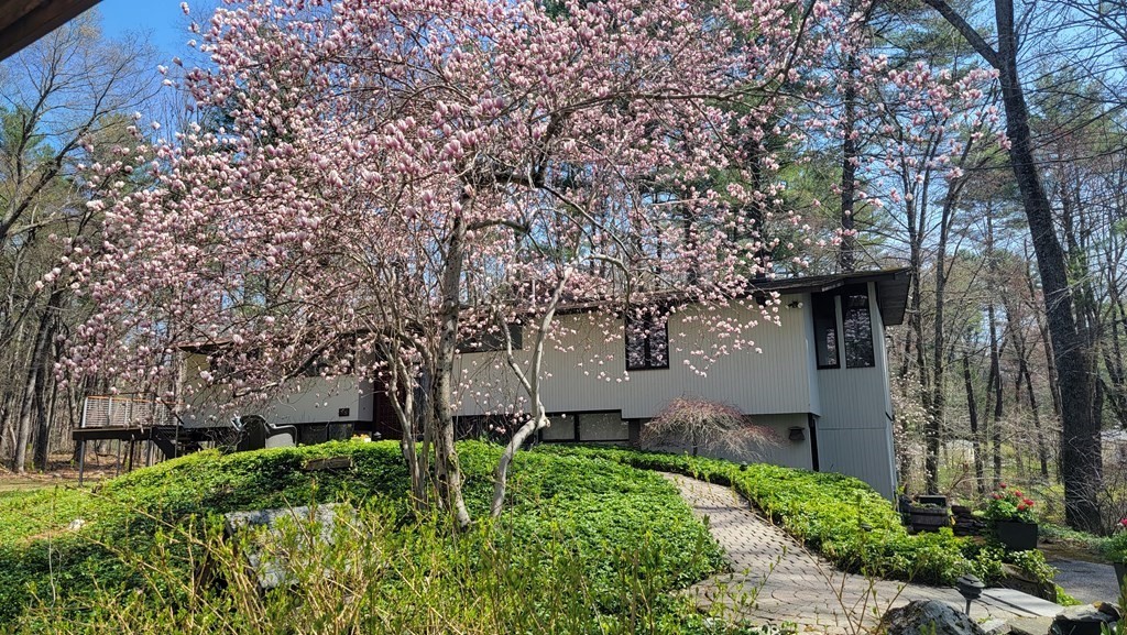 88 Heald Road Carlisle, MA 01741 - Photo 38 of 42 a front view of a house with garden