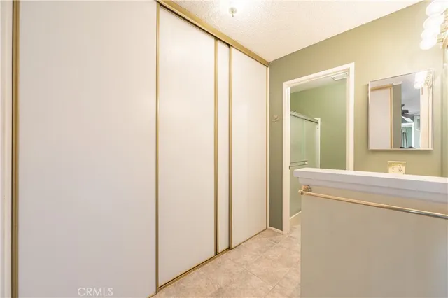 a bathroom with a double vanity sink toilet and a mirror
