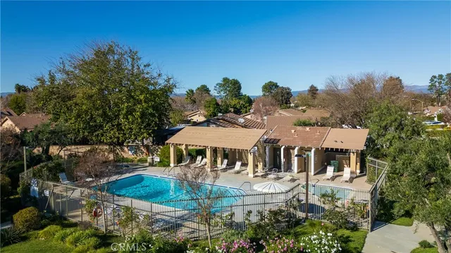 an outdoor space with furniture and garden