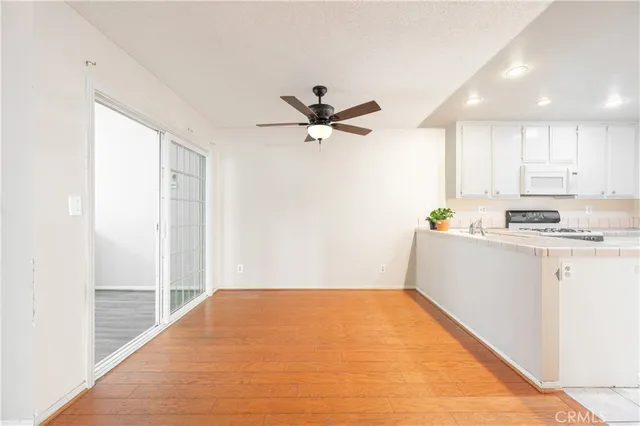 a very nice looking room with a ceiling fan