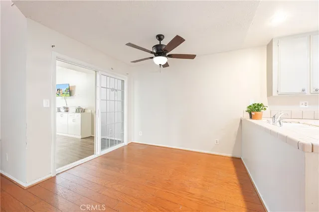 a view of a kitchen with a sink and a window