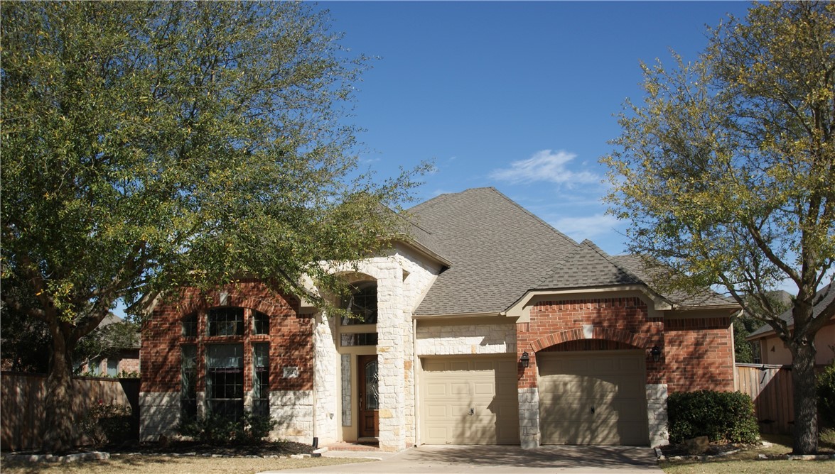 1921 Misty Ridge Leander, TX 78641 - Photo 1 of 1 a front view of a house with a yard