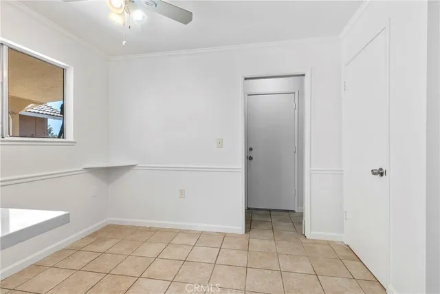 a view of an empty room with windows