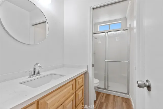 a bathroom with a glass shower door