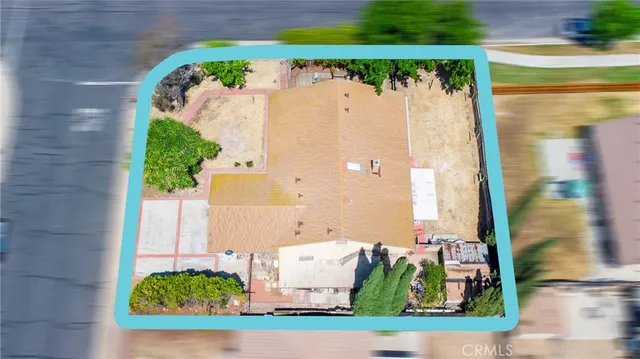 an aerial view of a house with pool