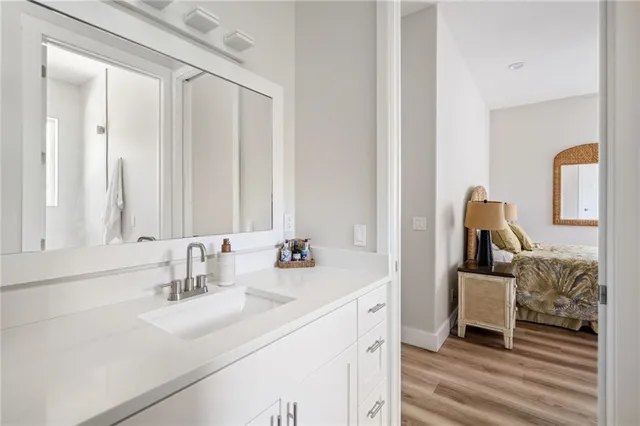 a en suite bathroom with a sink and mirror