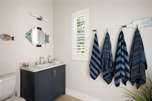 a bathroom with a sink and mirror
