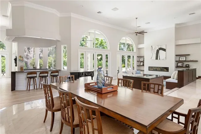 a view of a dining room with furniture and window