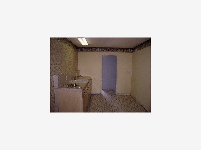 1579 Michigan Avenue San Jose, CA 95002 - Photo 4 of 8 a kitchen with a sink and a refrigerator