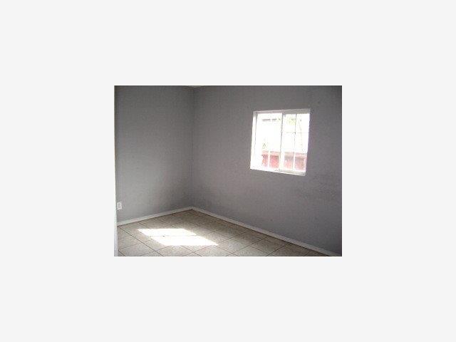 1579 Michigan Avenue San Jose, CA 95002 - Photo 6 of 8 a open kitchen with a white wall and a window