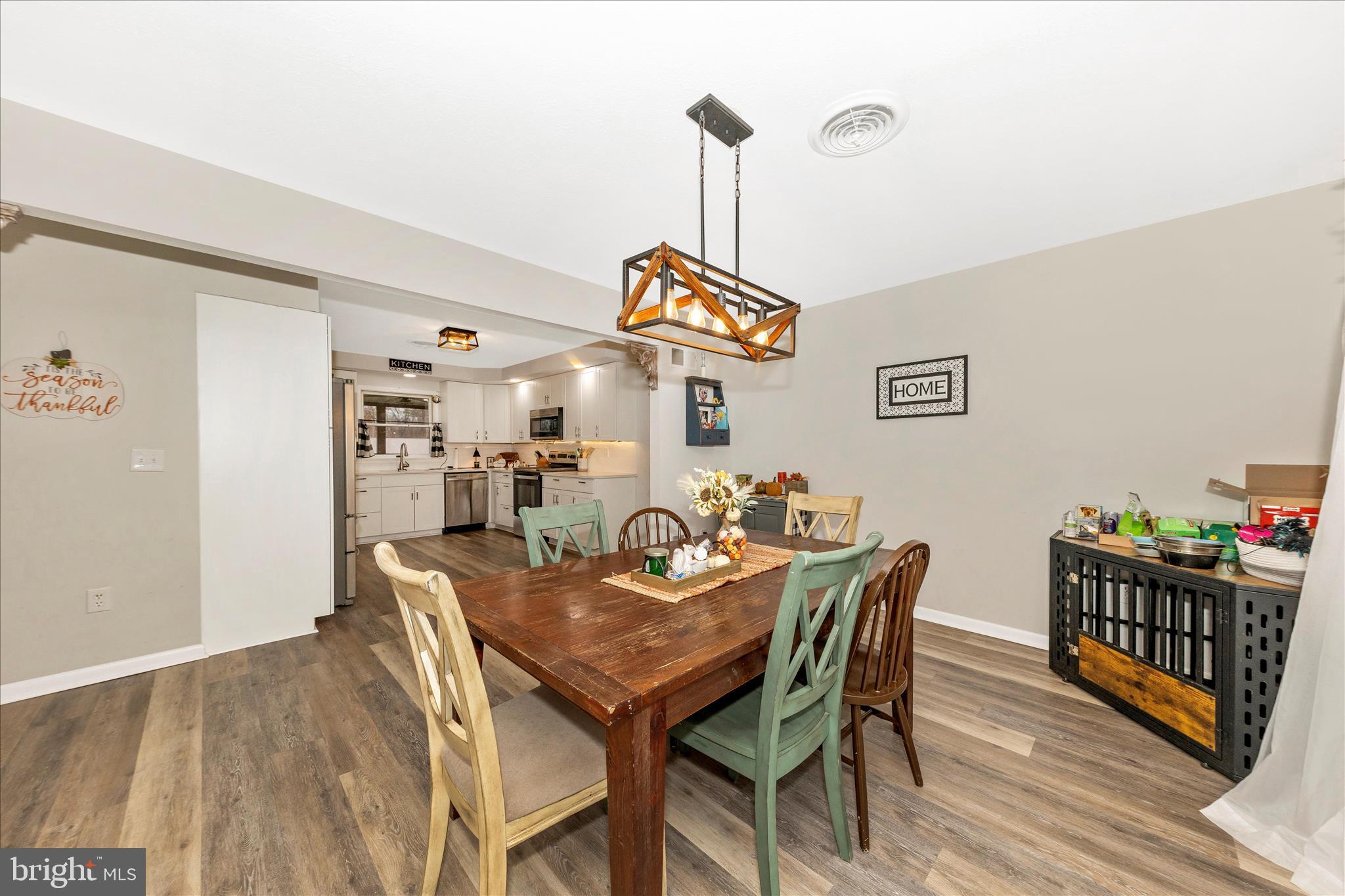 126 Game Trail Road Falling Waters, WV 25419 - Photo 14 of 41 a view of a dining room with furniture and wooden floor