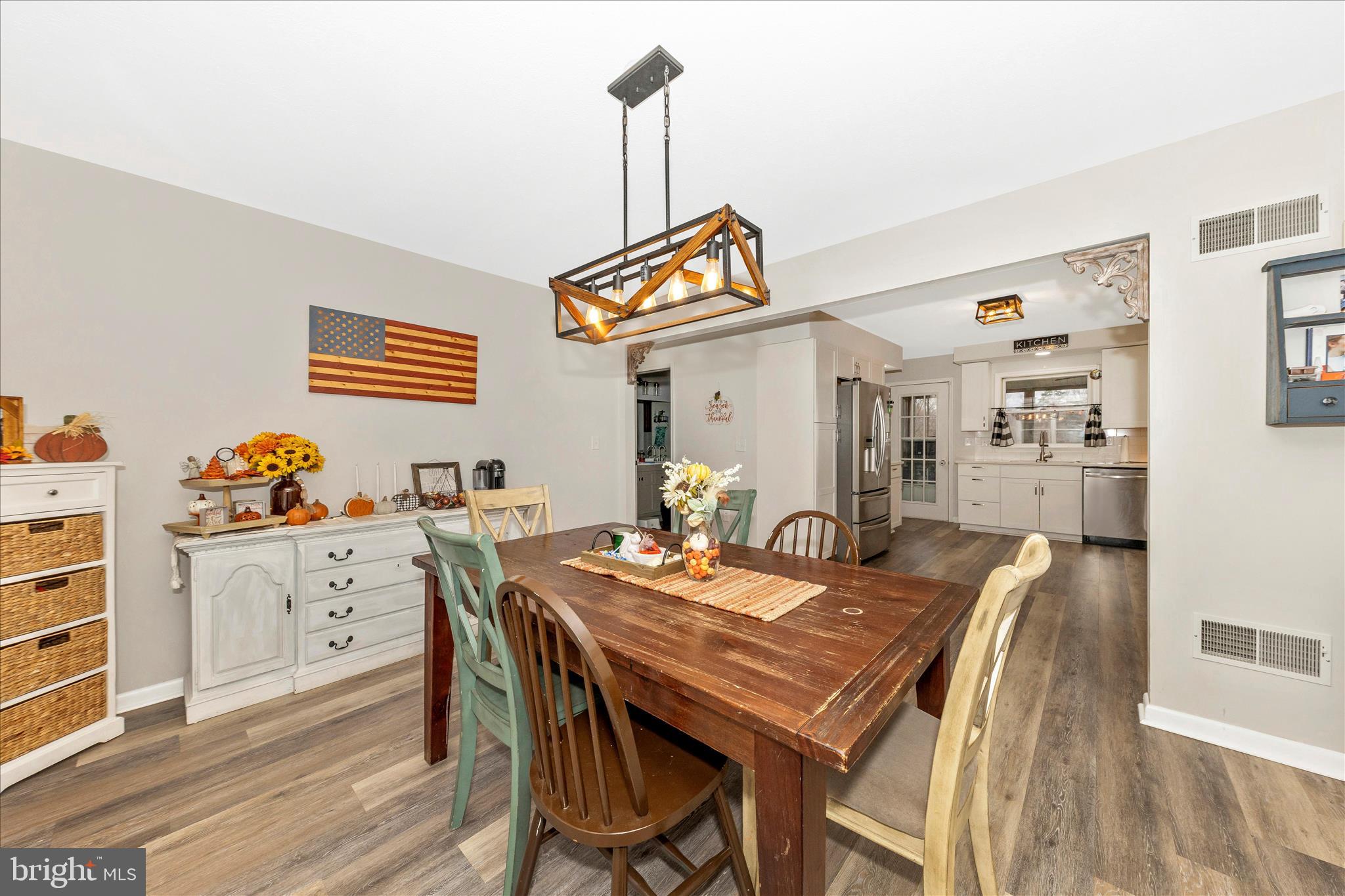 126 Game Trail Road Falling Waters, WV 25419 - Photo 16 of 41 a view of a dining room with furniture and wooden floor