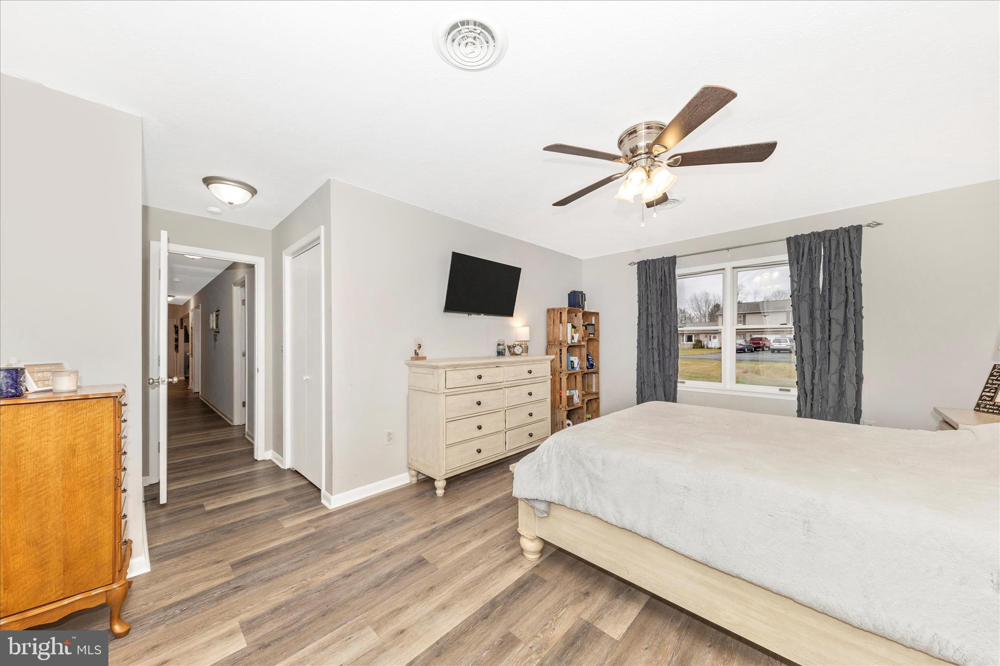 126 Game Trail Road Falling Waters, WV 25419 - Photo 18 of 41 a bedroom with a bed and a flat tv screen on dresser