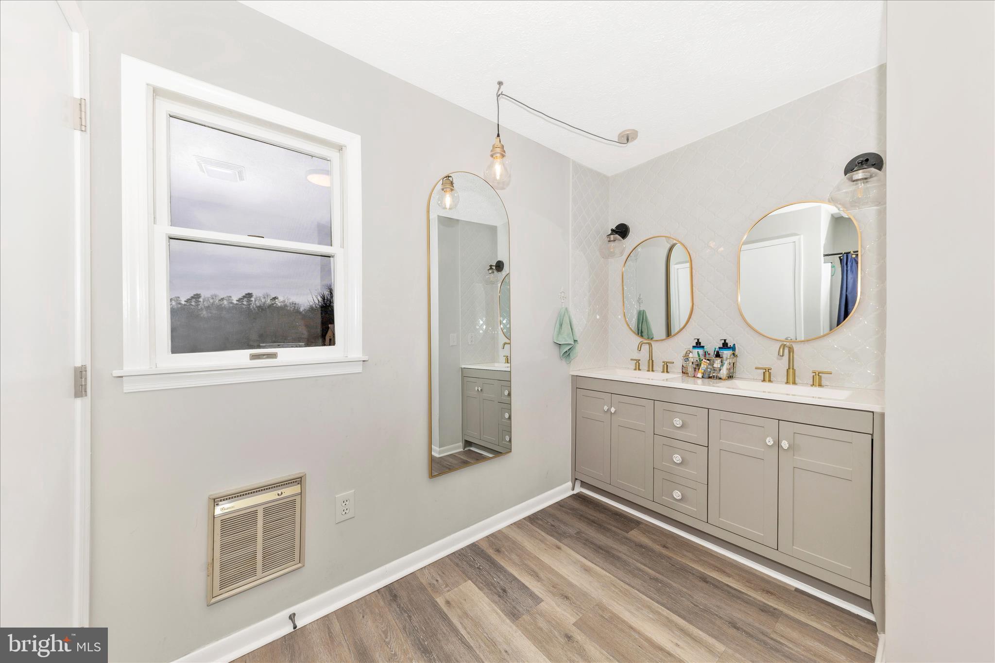 126 Game Trail Road Falling Waters, WV 25419 - Photo 20 of 41 a spacious bathroom with 2 sink a mirror and shower