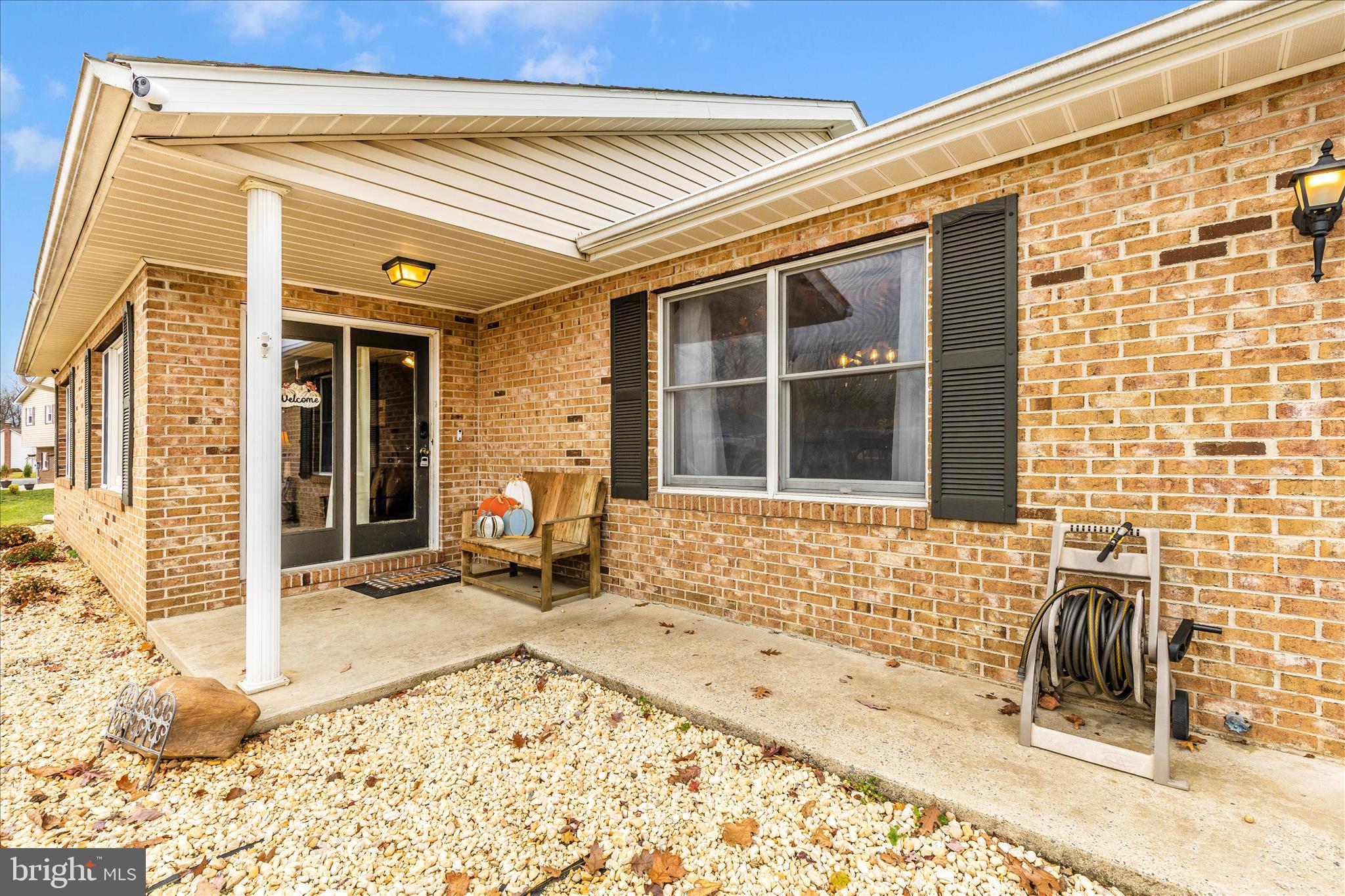 126 Game Trail Road Falling Waters, WV 25419 - Photo 2 of 41 a view of a house with a patio