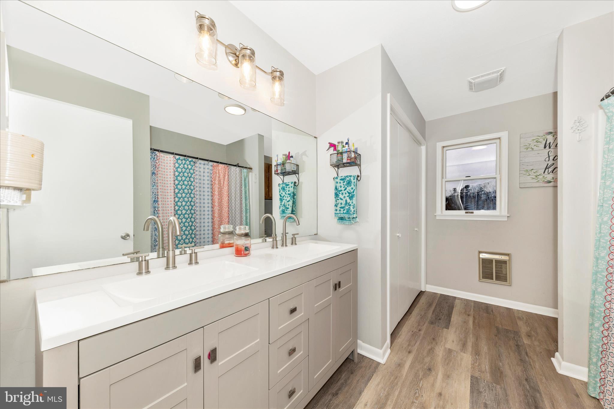 126 Game Trail Road Falling Waters, WV 25419 - Photo 23 of 41 a bathroom with a double vanity sink and mirror