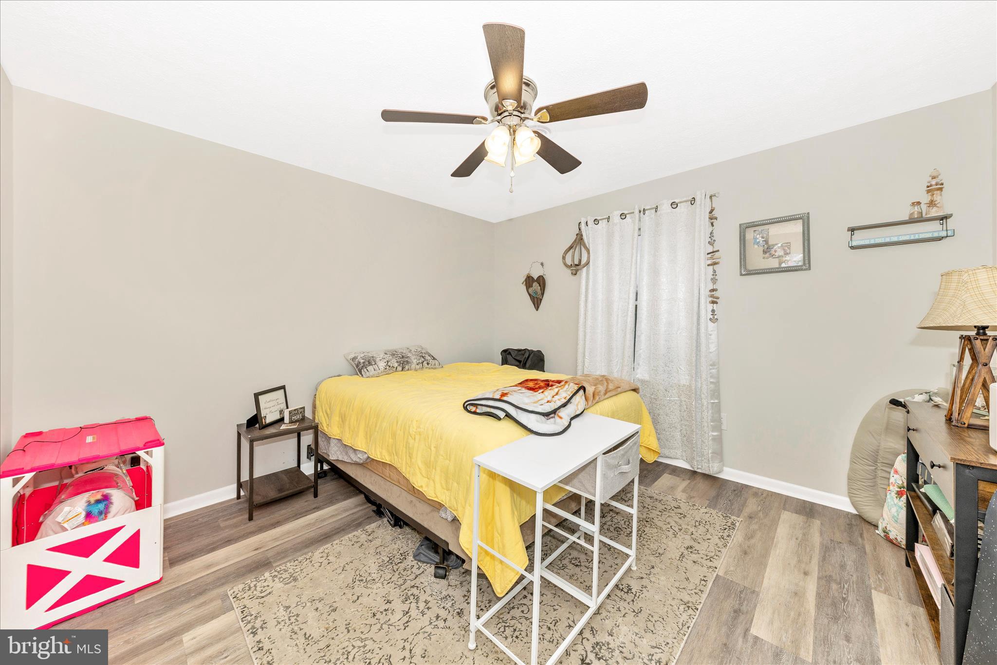 126 Game Trail Road Falling Waters, WV 25419 - Photo 29 of 41 a bedroom with a bed and a chandelier