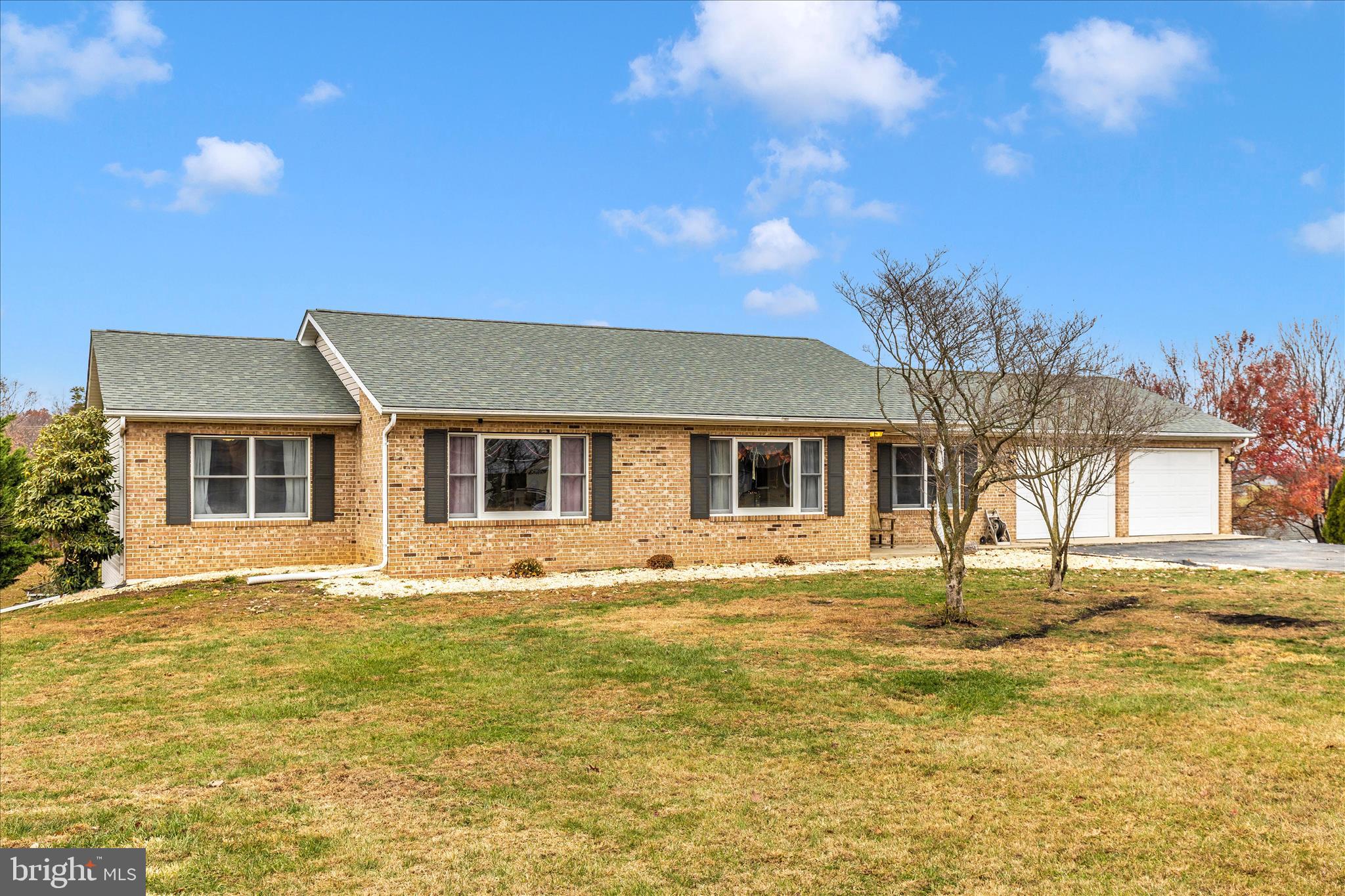 126 Game Trail Road Falling Waters, WV 25419 - Photo 38 of 41 a house view with swimming pool in front of it
