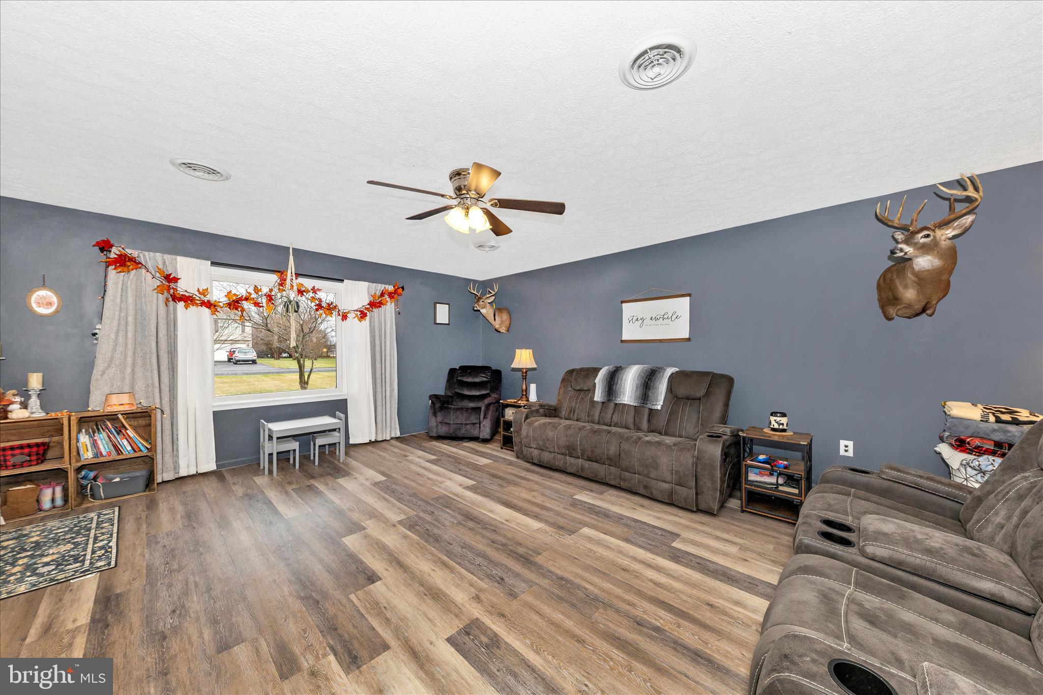 126 Game Trail Road Falling Waters, WV 25419 - Photo 5 of 41 a living room with furniture and a wooden floor