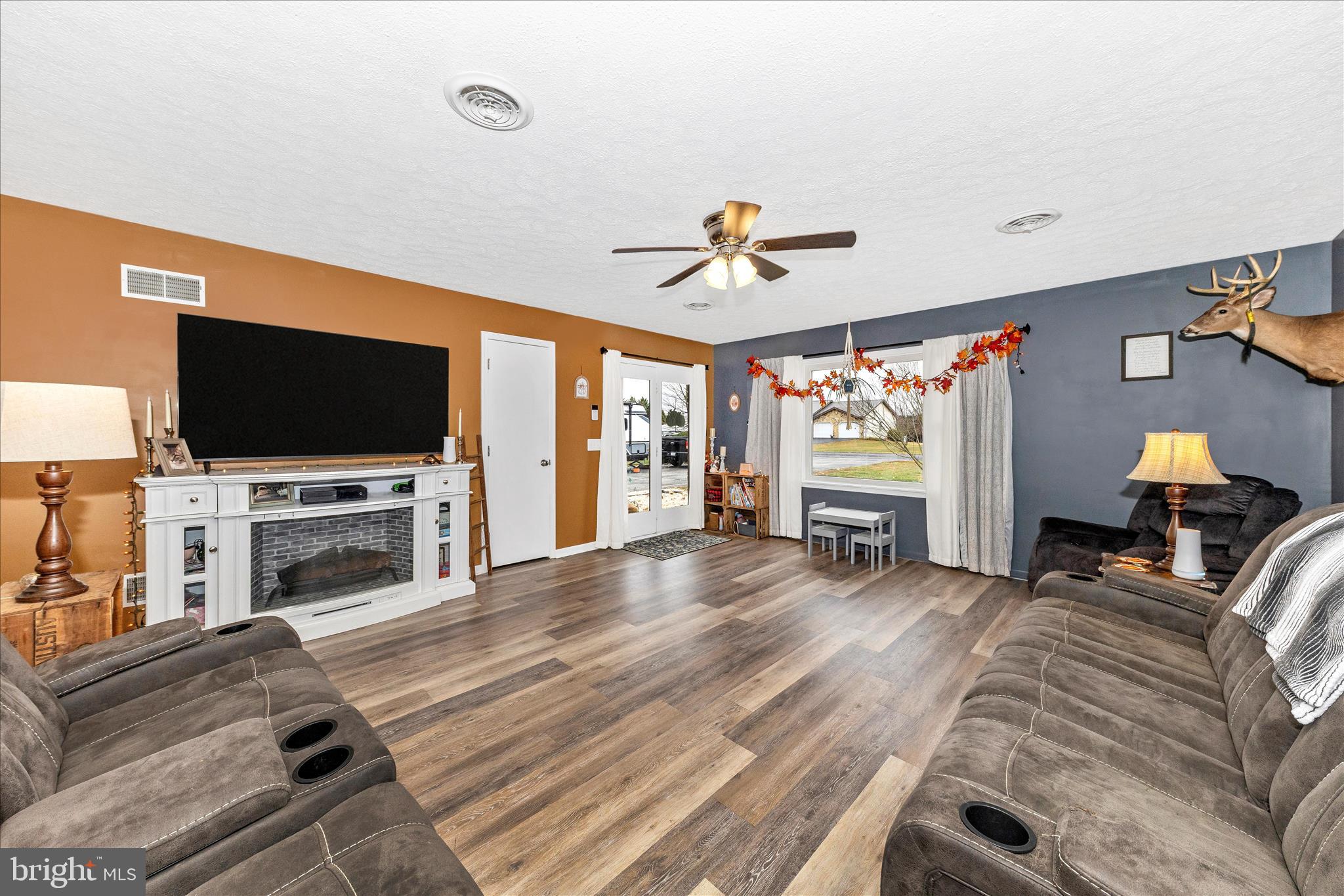 126 Game Trail Road Falling Waters, WV 25419 - Photo 6 of 41 a living room with furniture and a flat screen tv