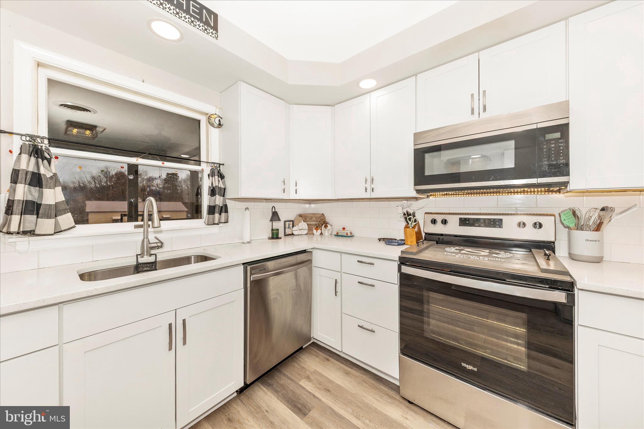 126 Game Trail Road Falling Waters, WV 25419 - Photo 9 of 41 a kitchen with cabinets stainless steel appliances and sink