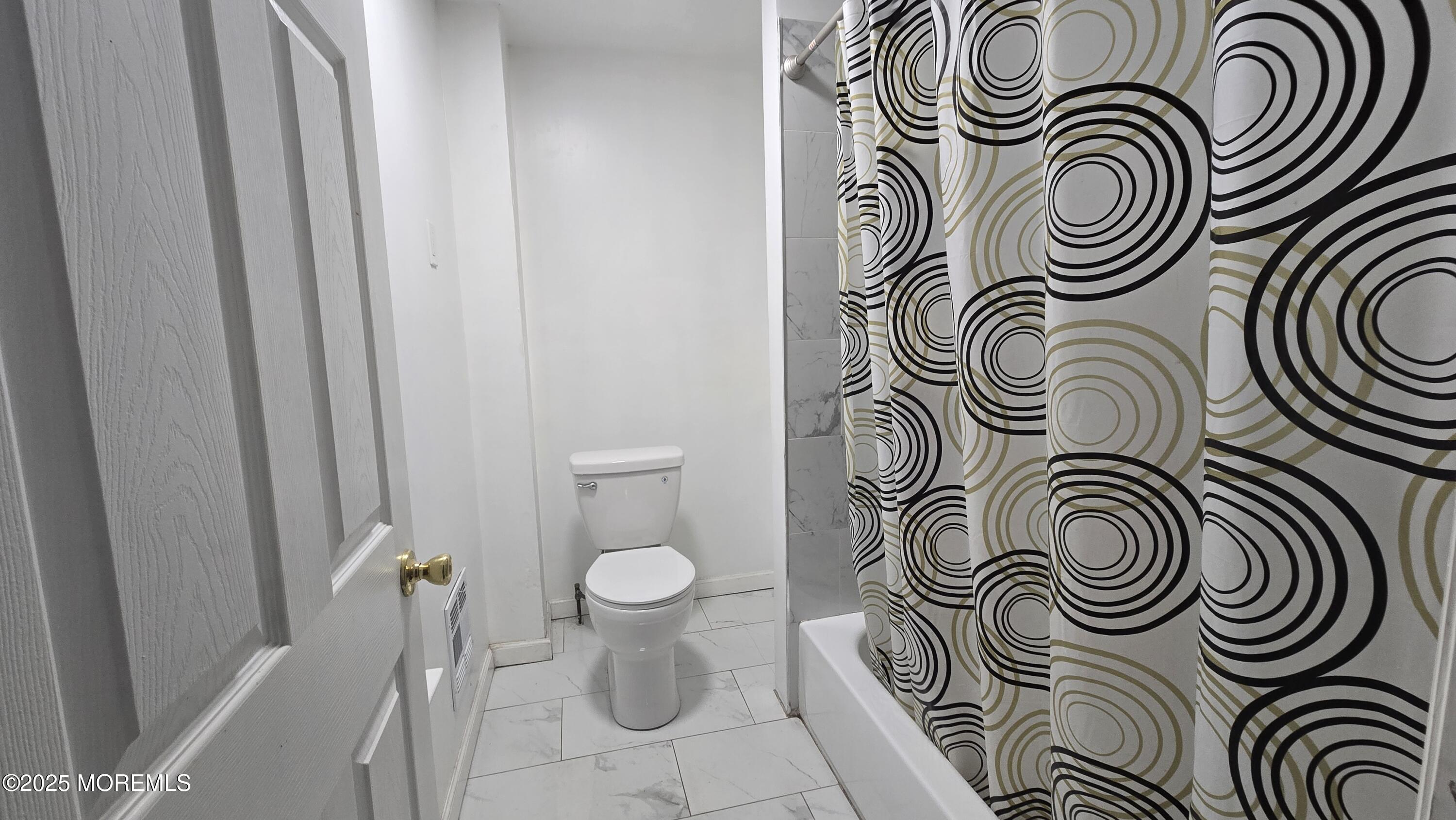 1219 Mattison Avenue, Unit 2 Asbury Park, NJ 07712 - Photo 9 of 11 a bathroom with a sink and a mirror