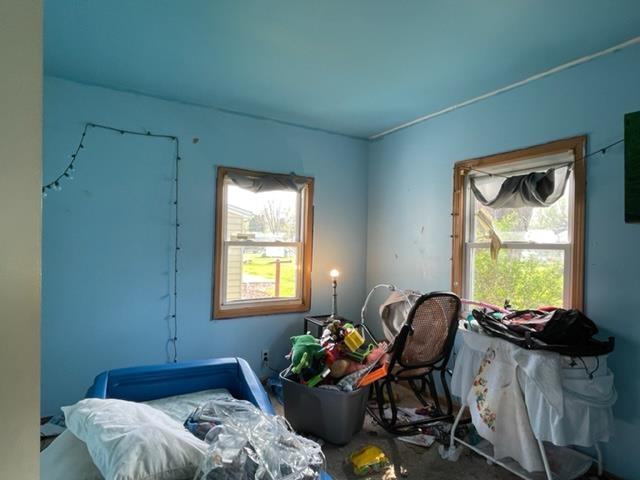 1102 1st Avenue Rochelle, IL 61068 - Photo 10 of 19 a livingroom with workspace and a window
